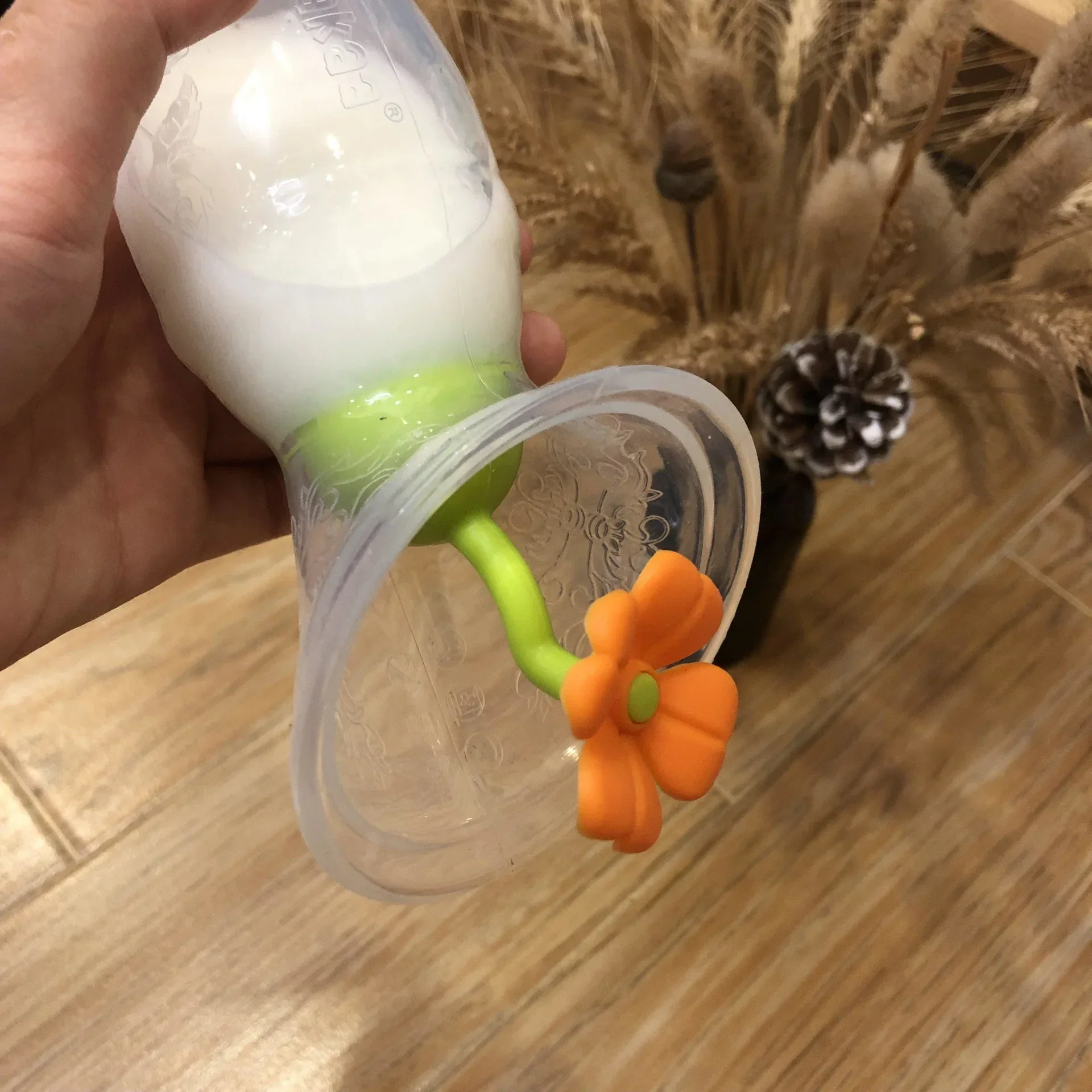 Haakaa® Silicone Breast Pump Flower Stopper Orange - Image 3